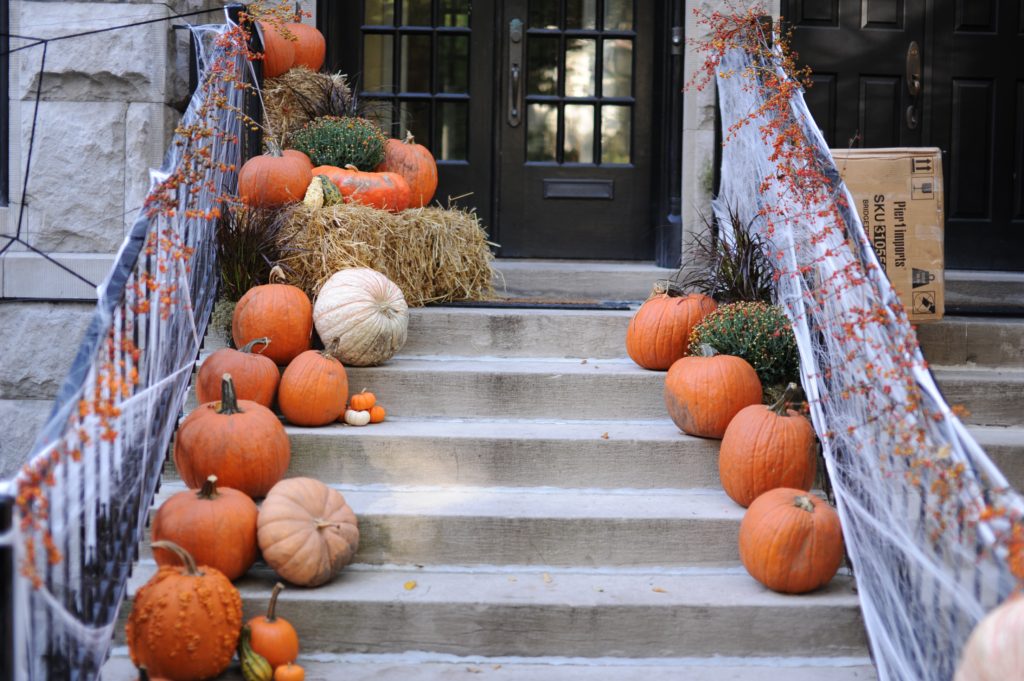 pumpkin and halloween decor on doorsteps low waste Halloween decoration