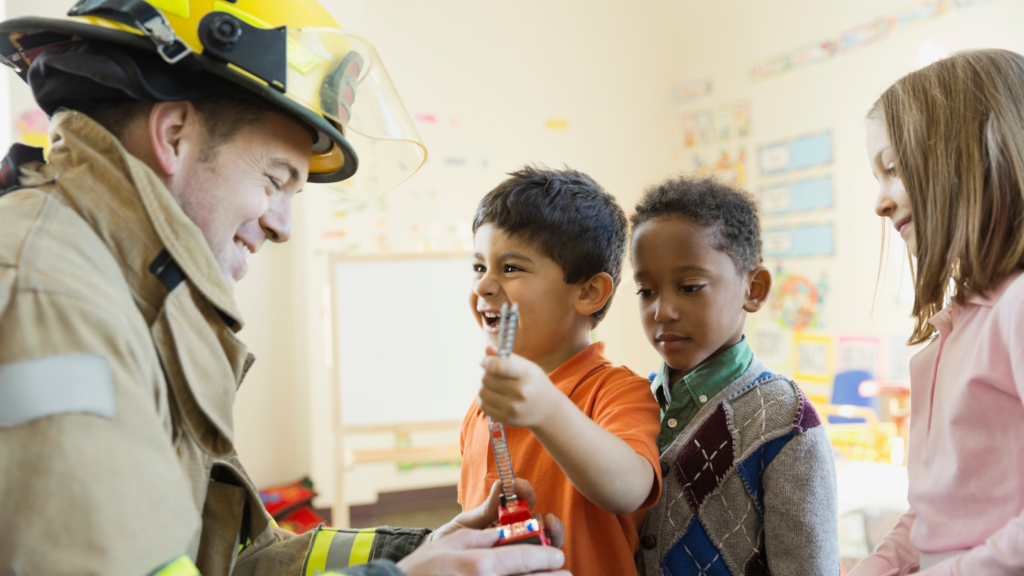 firesafe program firefighters giving resources to children and families to educate them about fire safety and prevention